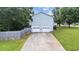 Back exterior of home featuring a two car garage and a long driveway at 536 Cherokee Overlook Court Ct, Canton, GA 30115