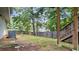 Backyard featuring a wooden fence and stairs leading to a deck at 536 Cherokee Overlook Court Ct, Canton, GA 30115