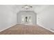 Carpeted bedroom featuring a ceiling fan and a bank of windows at 536 Cherokee Overlook Court Ct, Canton, GA 30115