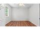 Simple bedroom with ample natural light, vinyl flooring and a built-in cabinet for organization at 536 Cherokee Overlook Court Ct, Canton, GA 30115