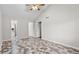 A spacious bedroom with vinyl flooring, ceiling fan, and a walk-in closet, offering comfort and storage at 536 Cherokee Overlook Court Ct, Canton, GA 30115