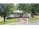 Charming single-story home with a front porch and mature trees in a residential neighborhood at 536 Cherokee Overlook Court Ct, Canton, GA 30115