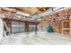 Spacious two-car garage with concrete floors, exposed insulation, and dual garage doors at 536 Cherokee Overlook Court Ct, Canton, GA 30115