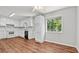 Bright kitchen featuring white cabinets, updated appliances, and hardwood flooring, providing a modern space at 536 Cherokee Overlook Court Ct, Canton, GA 30115