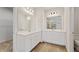 Bathroom with double vanity and white cabinets at 609 Elsa Lane Lot 76, Mcdonough, GA 30252