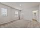 Bedroom featuring carpeted floors, natural light, and en suite bathroom at 609 Elsa Lane Lot 76, Mcdonough, GA 30252