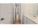 Hallway leading into additional rooms with an adjacent bathroom at 609 Elsa Lane Lot 76, Mcdonough, GA 30252
