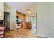 Traditional kitchen with wood cabinets, modern appliances and an island with laminate floors at 145 Deep Step Rd, Covington, GA 30014