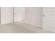 Spacious bedroom with plush carpeting and multiple doorways at 215 Silver Moon Dr, Loganville, GA 30052