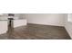 Spacious open layout with wood floors seamlessly connecting the living and kitchen areas at 215 Silver Moon Dr, Loganville, GA 30052