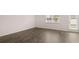 Living room with natural light and wood-look flooring at 215 Silver Moon Dr, Loganville, GA 30052