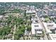 Overhead view of the neighborhood with green trees, city buildings and a sports field at 2972 Lookout Ne Pl, Atlanta, GA 30305