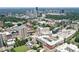 Scenic aerial view of the community with green trees, city buildings, and a green lawn at 2972 Lookout Ne Pl, Atlanta, GA 30305