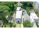 Birds eye view of a three-story home with a metal roof in a neighborhood with trees at 2972 Lookout Ne Pl, Atlanta, GA 30305