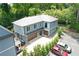 Beautiful blue home with a garage and extra parking surrounded by mature trees at 2972 Lookout Ne Pl, Atlanta, GA 30305