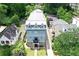 Aerial view of a three-story home with a metal roof, surrounded by mature trees at 2972 Lookout Ne Pl, Atlanta, GA 30305
