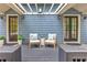 Outdoor deck with cozy seating and a pergola, perfect for relaxing or entertaining guests at 2972 Lookout Ne Pl, Atlanta, GA 30305
