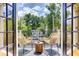 Inviting balcony featuring two wicker chairs and charming neighborhood views, perfect for relaxing outdoors at 2972 Lookout Ne Pl, Atlanta, GA 30305