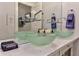 This bathroom features a triple vessel sink vanity with a quartz counter at 2972 Lookout Ne Pl, Atlanta, GA 30305