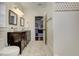 Bathroom showcasing double vanity, walk-in shower, and connecting bedroom at 2972 Lookout Ne Pl, Atlanta, GA 30305