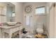 A bathroom showcases a vintage sink and gray and white checkered flooring at 2972 Lookout Ne Pl, Atlanta, GA 30305