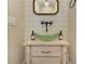 Unique powder room boasting a green glass vessel sink, adding a touch of modern elegance to the space at 2972 Lookout Ne Pl, Atlanta, GA 30305