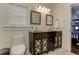 Bathroom with dual sinks, dark wood vanity, and a view into the bunk room at 2972 Lookout Ne Pl, Atlanta, GA 30305