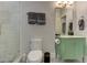 This bathroom features a walk-in shower and a pea-green vanity with a white counter at 2972 Lookout Ne Pl, Atlanta, GA 30305