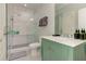 This bathroom features a walk-in shower and a pea-green vanity with a white sink at 2972 Lookout Ne Pl, Atlanta, GA 30305