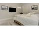 This bedroom features neutral walls, dark decor, and natural light near the bed at 2972 Lookout Ne Pl, Atlanta, GA 30305