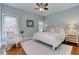 Light-filled bedroom with wood floors and stylish decor at 2972 Lookout Ne Pl, Atlanta, GA 30305