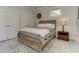 The bedroom features a rustic wood bed frame and a natural light from the window at 2972 Lookout Ne Pl, Atlanta, GA 30305