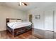 A bedroom showcasing a dark wood bed frame and hardwood flooring throughout the room at 2972 Lookout Ne Pl, Atlanta, GA 30305