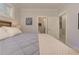This bedroom features a rustic bed frame with natural light from the bathroom at 2972 Lookout Ne Pl, Atlanta, GA 30305
