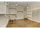 Large walk-in closet with custom shelving and hanging racks at 2972 Lookout Ne Pl, Atlanta, GA 30305