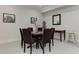 Dining area features seating for six around a round table with carpet and picture frames at 2972 Lookout Ne Pl, Atlanta, GA 30305