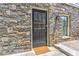 Charming stone exterior with a classic black front door and matching window at 2972 Lookout Ne Pl, Atlanta, GA 30305