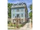 Charming three-story home with blue siding, stone accents, and a well-maintained front yard at 2972 Lookout Ne Pl, Atlanta, GA 30305