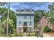 Charming three-story home with blue siding, stone accents, and a well-maintained front yard at 2972 Lookout Ne Pl, Atlanta, GA 30305