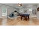 Bright game room features a stylish pool table, natural light, and an adjacent workspace at 2972 Lookout Ne Pl, Atlanta, GA 30305