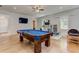 Spacious game room features a stylish pool table, ceiling fan, recessed lighting, and abundant natural light at 2972 Lookout Ne Pl, Atlanta, GA 30305