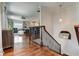 Inviting hallway with hardwood floors, elegant staircase, and views of the living spaces at 2972 Lookout Ne Pl, Atlanta, GA 30305