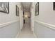 Spacious hallway with neutral decor, framed artwork, and recessed lighting at 2972 Lookout Ne Pl, Atlanta, GA 30305