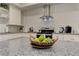 Granite countertop with pears and stainless steel appliances in this modern kitchen and light backsplash at 2972 Lookout Ne Pl, Atlanta, GA 30305
