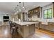Gourmet kitchen with stainless steel appliances, an island with bar seating and pendant lights at 2972 Lookout Ne Pl, Atlanta, GA 30305