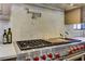 Close up of gourmet stove and pot filler in a chef's kitchen with marble backsplash at 2972 Lookout Ne Pl, Atlanta, GA 30305