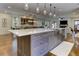 Open concept kitchen island with seating and easy access to dining and living areas at 2972 Lookout Ne Pl, Atlanta, GA 30305