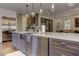 Kitchen island with stainless steel sink, dishwasher, and a view to the dining area at 2972 Lookout Ne Pl, Atlanta, GA 30305