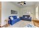 Inviting living room featuring comfortable blue sofas, natural light, and a stylish patterned rug at 2972 Lookout Ne Pl, Atlanta, GA 30305
