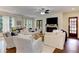 Living room with hardwood floors, a fireplace, and lots of natural light coming through the windows at 2972 Lookout Ne Pl, Atlanta, GA 30305